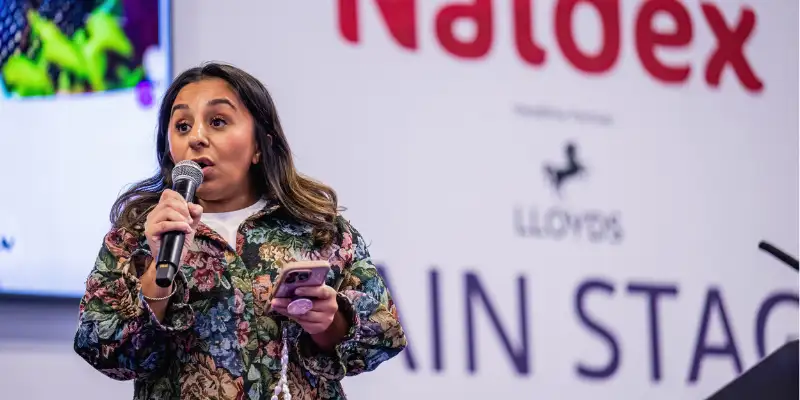 Speaker on a stage at Naidex