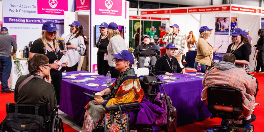 Visitors speaking with inclusive employers at the Recruitment Fair at Naidex