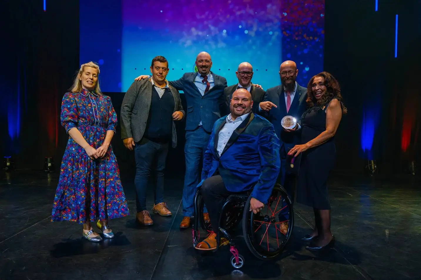 The Nimbus Disability team at the 2025 UK Tech Awards holding their Tech for Good award 