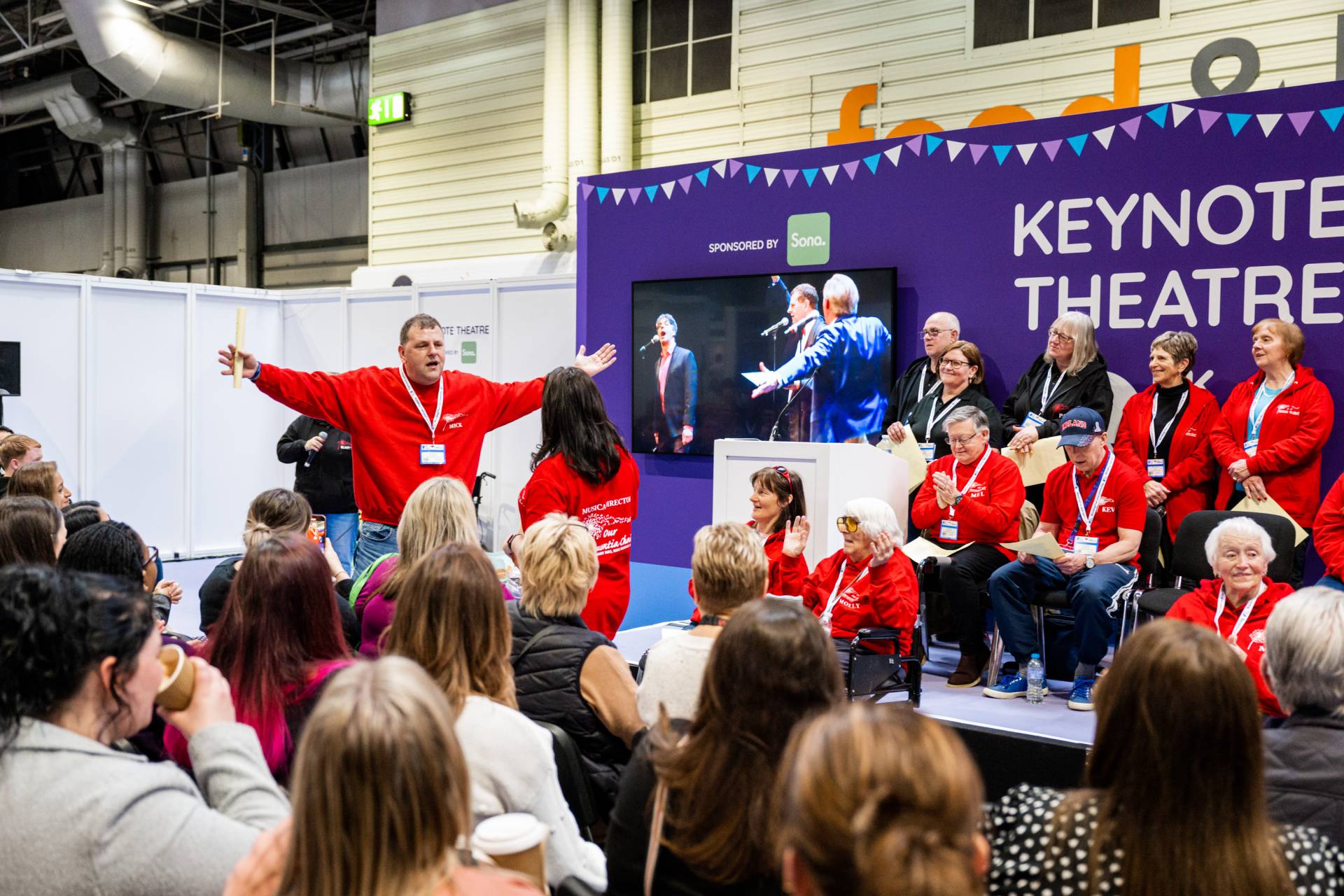 Crowd seat at Naidex engaged and smiling
